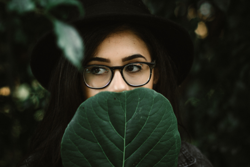 Coworkers hiding behind leaves: WE SEE YOU!