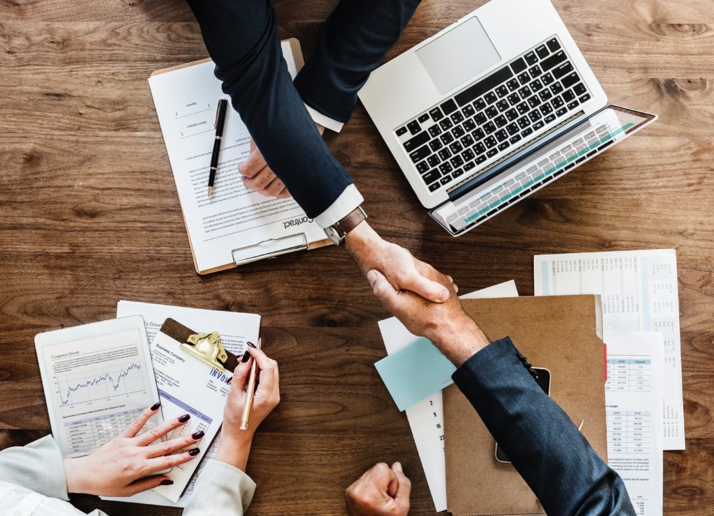 Handshake over table